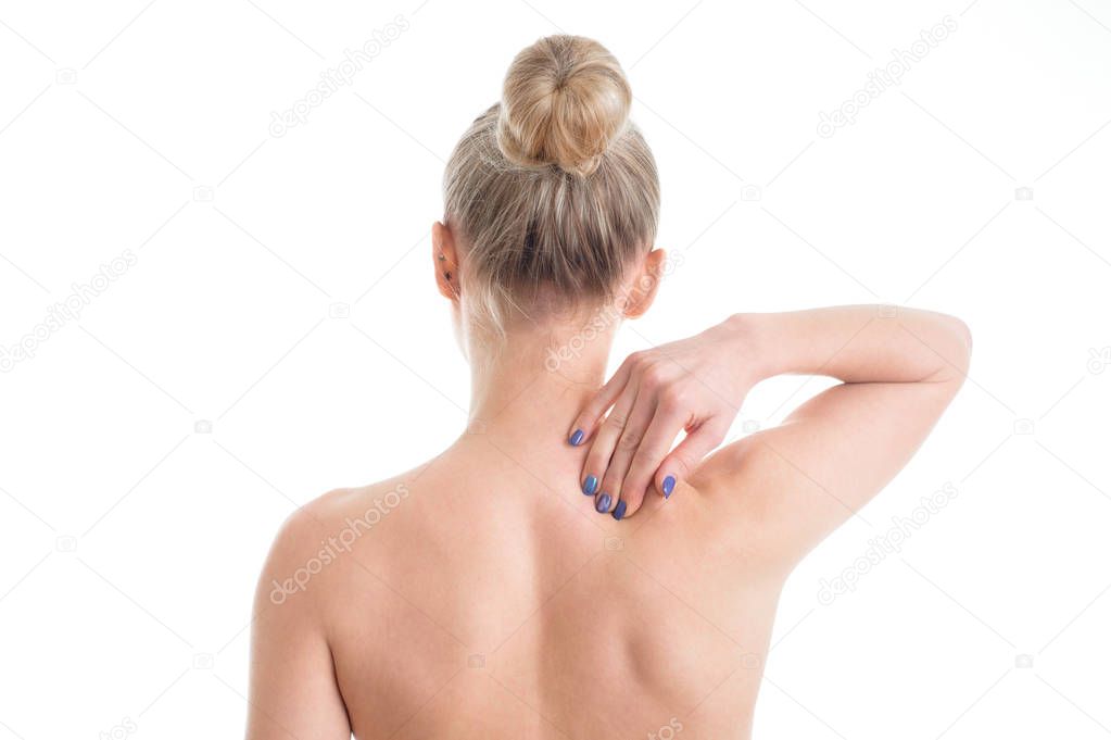 young female nude  with neckache touching her neck. Isolated on 