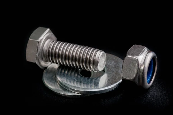 Bolt with a nut and washers — Stock Photo, Image