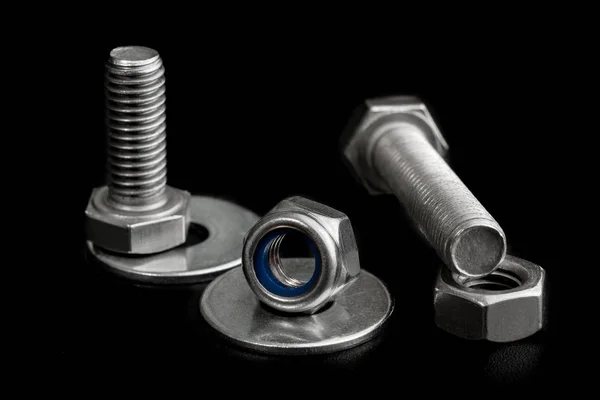 Tool Set Of Iron Screws And Nuts. Closeup on black background — Stock Photo, Image