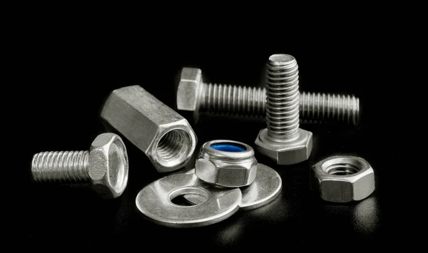 Steel screw parts isolated on black background — Stock Photo, Image