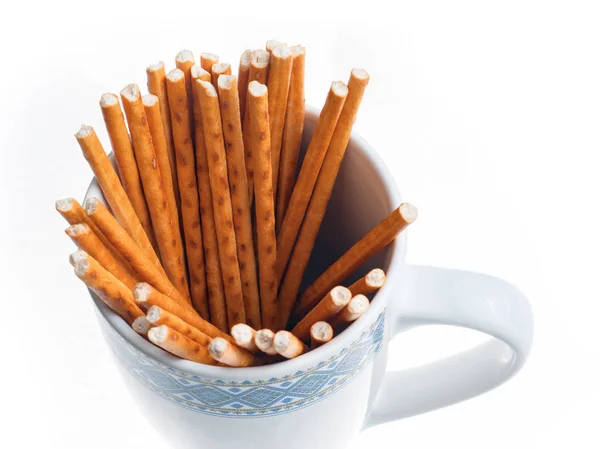 Palitos de pan en una taza aislada en blanco — Foto de Stock