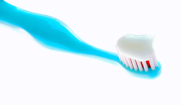 Blue children's toothbrush with toothpaste environmental — Stock Photo, Image