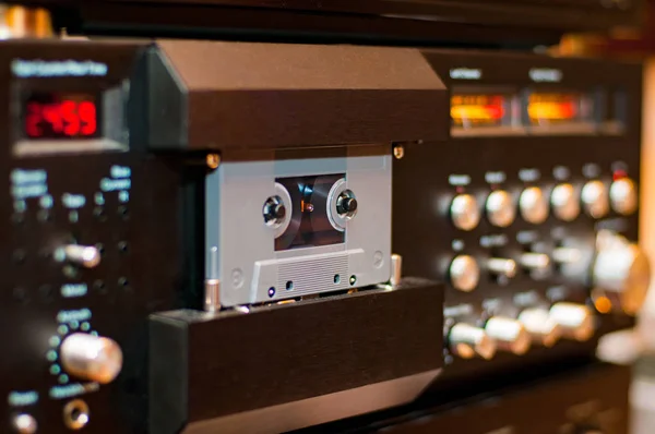 Old compact audio cassette in vintage audio system with tape rec — Stock Photo, Image