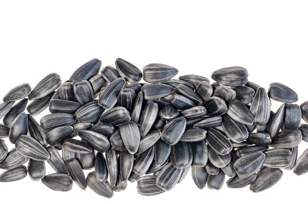 Black Sunflower seeds isolated on white, top view — Stock Photo, Image