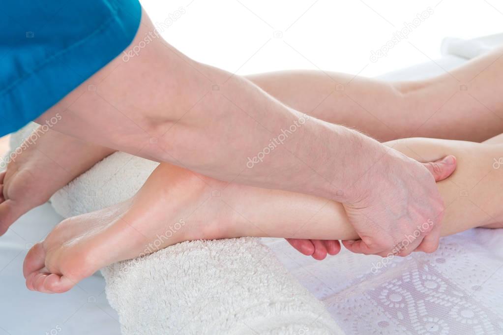 Sports Leg Massage. Massage therapist working with patient, mass