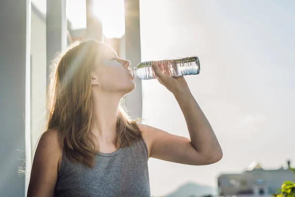 Portrait of Beauty Red-haired woman with eye patches drinks water. Spa Girl — Stock Photo, Image