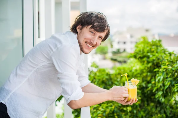 Pineapple cocktail in the hands man — Stock Photo, Image