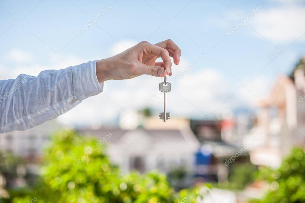 man holding a key to the house