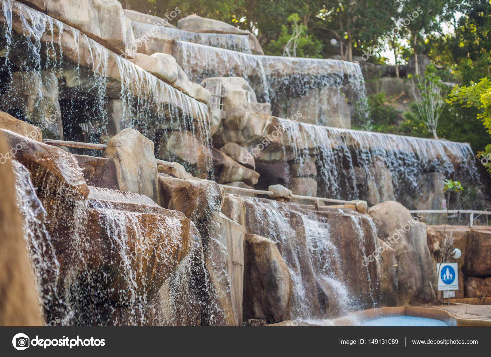 Artificial waterfall in the park of mineral springs Stock Photo by ©galitskaya 149131089