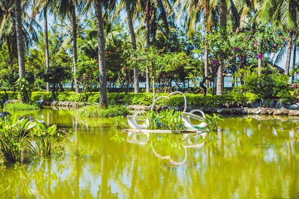 Swans on the lake from old tires