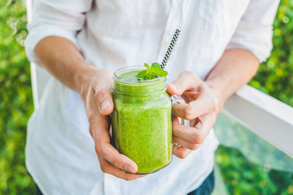 Mason jar mug filled with green spinach