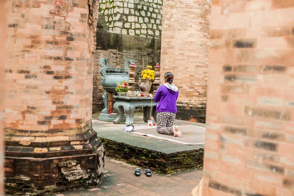 Woman prays in Po Nagar Cham Tovers. Asia Travel concept. Journey through Vietnam Concept.