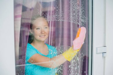 Beautiful female maid doing the housework clipart