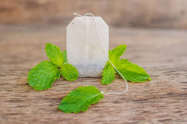 Tea bags on wooden background — Stock Photo, Image