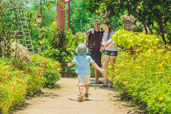 Happy young family spending time outdoor — Stock Photo, Image