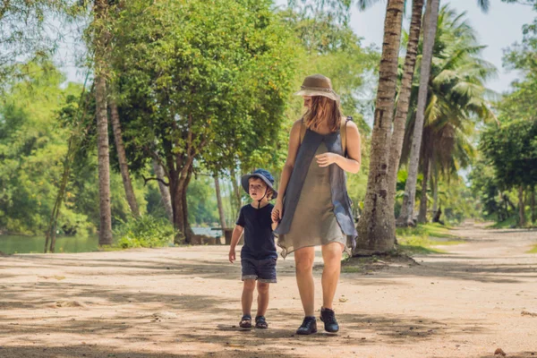 Mom and son  on the forest road. — Stock Photo, Image