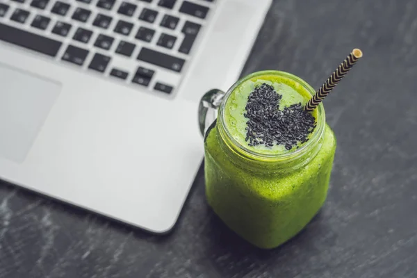 green smoothie with banana and spinach