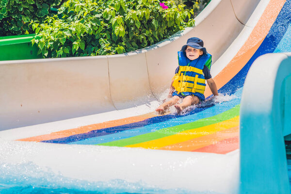  boy  slides down from a slide