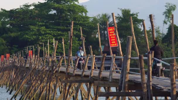 Motorbikes crossing a river — Stock Video