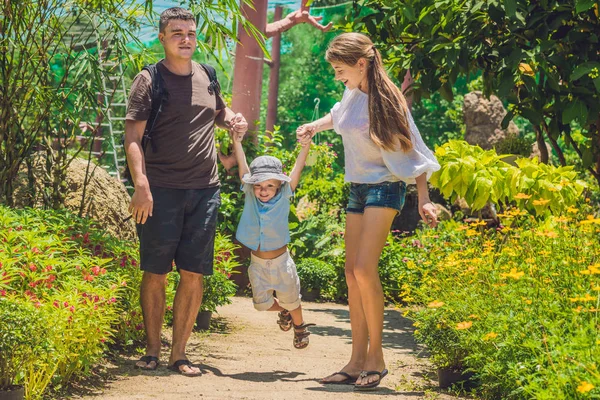 Young family spending time outdoor — Stock Photo, Image