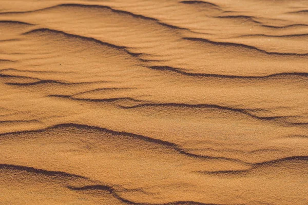 Zand met golven in de woestijn — Stockfoto
