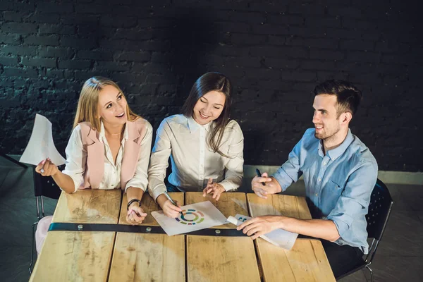 Team of coworkers watching storyboard — Stock Photo, Image