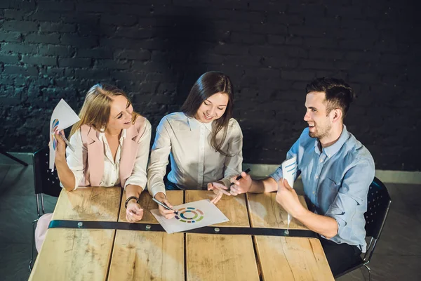 Team of coworkers watching storyboard — Stock Photo, Image