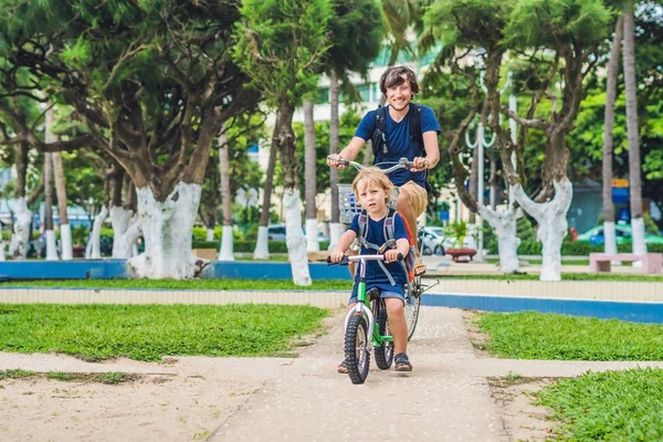 Happy family is riding bikes