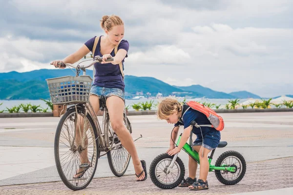 Happy family is riding bikes