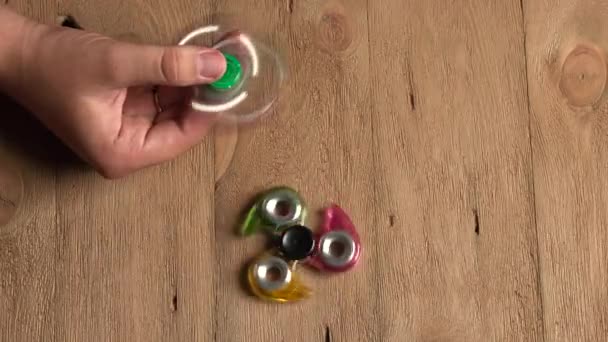 Male hand holding hand spinner — Stock Video