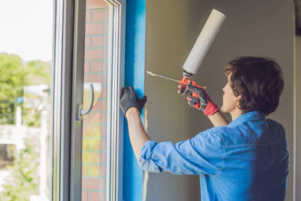 Man in does window installation — Stock Photo, Image