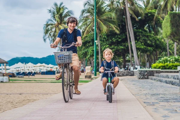 Happy family is riding bikes