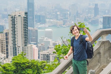 Man taking selfie at Viewing platform on top of Peak Tower clipart