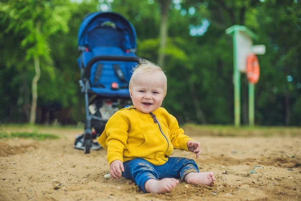 Toddler boy playing with sand — Stock Photo, Image