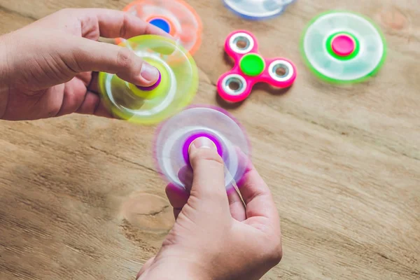 A man hands holding hand spinner — Stock Photo, Image