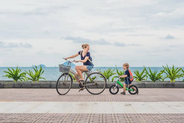 Happy family is riding bikes