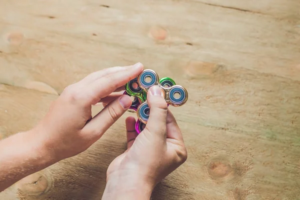 A man hands holding hand spinner — Stock Photo, Image