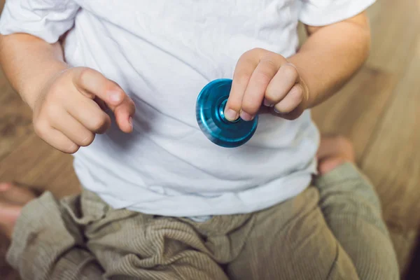 Young boy play with spinner — Stock Photo, Image