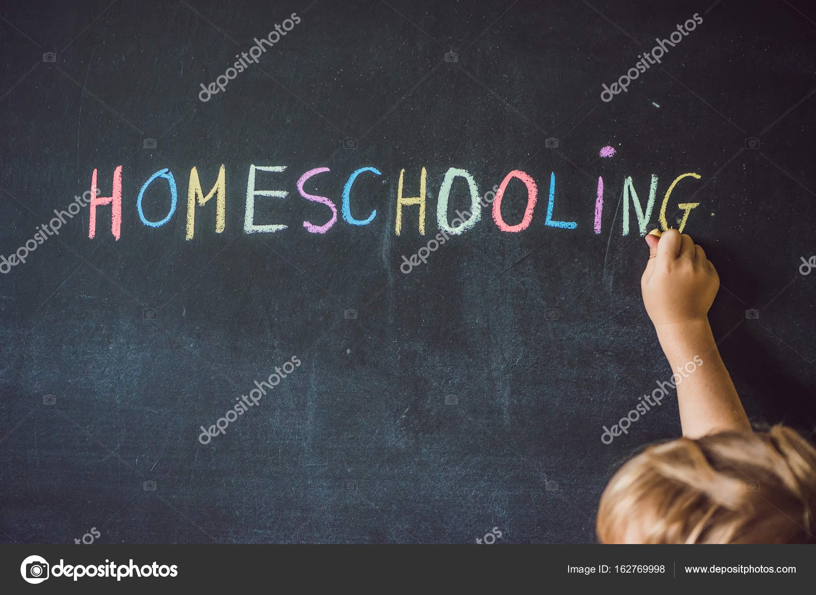Child pointing at word Homeschooling Stock Photo by ©galitskaya 162769998