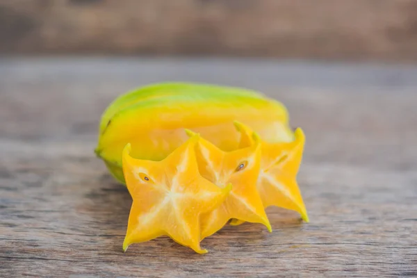 Star fruits on wooden table