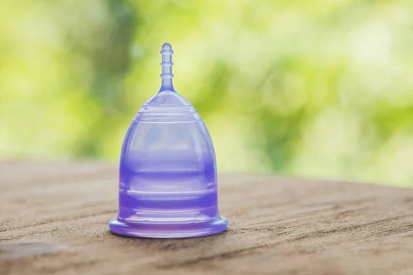 Menstrual cup On a wooden background — Stock Photo, Image