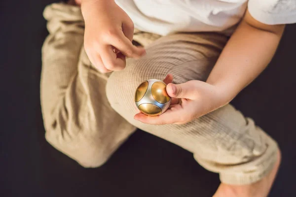 Young boy play with fidget spinner — Stock Photo, Image