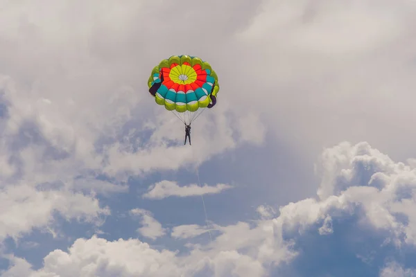 Young woman flies on a parachute — Stock Photo, Image