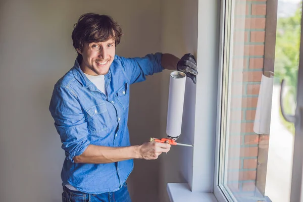 Man does window installation — Stock Image Man does window installation Stock Photo