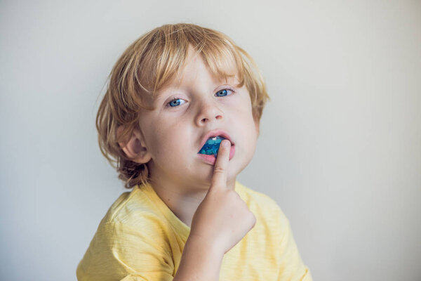 Three-year old boy shows myofunctional trainer to illuminate mouth