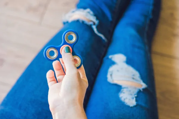 Girl Teenager Holey Jeans Holds Hands Plays Spinner — Stock Photo, Image