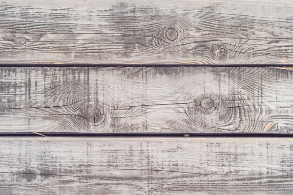 rustic weathered barn wood background with knots and nail holes