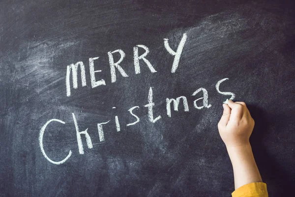 Niño escribió la inscripción Feliz Navidad —  Fotos de Stock