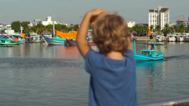 Little boy walking around Dinh Cau lighthouse symbol of the island Phu Quoc, Vietnam — Stock Video