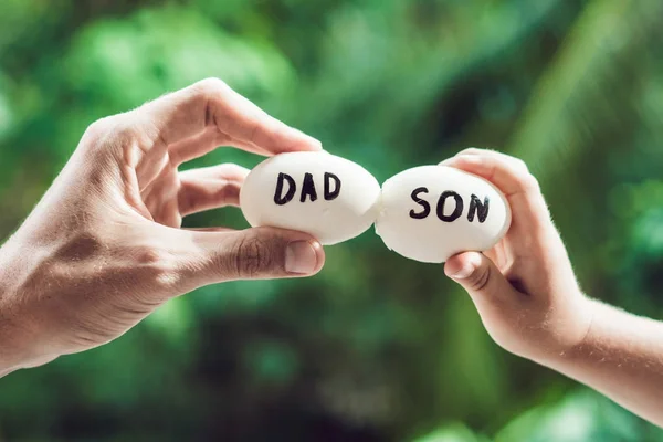 Eggs with inscriptions father and son. Problems between father a — Stock Photo, Image